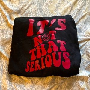 Black and red “it’s not that serious” sweatshirt